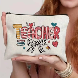 Canvas teacher gift makeup bag with teacher lettering and colorful floral heart pattern