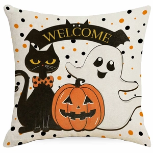 Detail of linen Halloween pillow cover featuring black cat, ghost, and pumpkin graphics