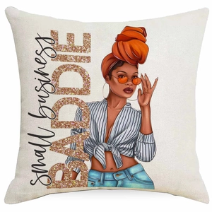 Close-up of linen cushion cover with Black woman illustration and BADDIE lettering