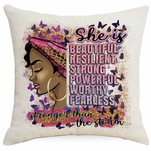 Detail of linen cushion cover with African woman illustration and inspiring text