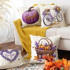 Set of 4 Thanksgiving pillow covers with lavender pumpkins and flowers on a sofa
