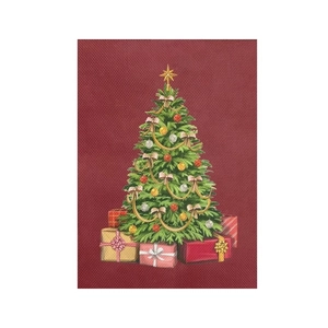 Detail of red Christmas wall hanging featuring a decorated tree and gift boxes