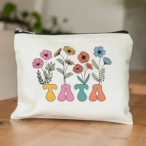 Detailed macro view of retro floral canvas pouch with artistic TATA letter printing