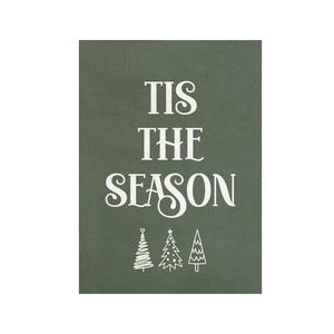 Macro shot showing texture of green fabric Christmas banner with Tis The Season text