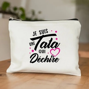 Detail of canvas makeup bag with French text print and high-quality black zipper closure
