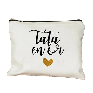 Minimalist white canvas makeup bag with black Tata en Or text and golden sequin heart