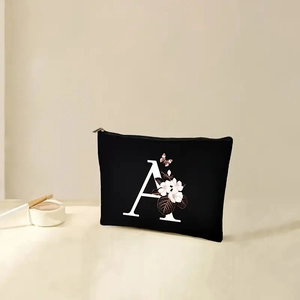 Floral letter A printed black makeup bag with zipper and elegant botanical pattern decor