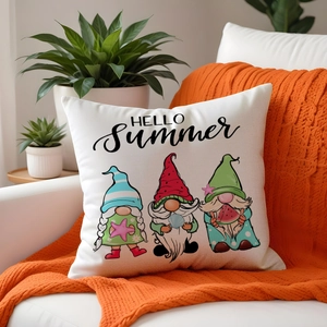 Detail view of summer gnome linen pillowcase with Hello Summer text on white sofa
