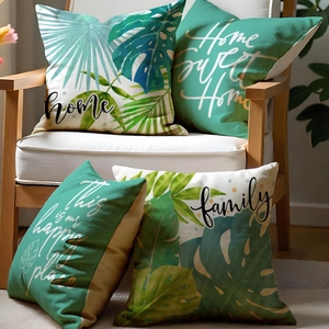 Set of four tropical plant pillow covers with palm leaves and home family text