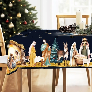 Close-up of a blue Nativity scene tablecloth with Mary, Joseph, and Jesus in a stable