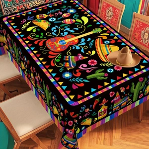 Close-up of Mexican festive tablecloth featuring colorful guitar and cactus prints on black