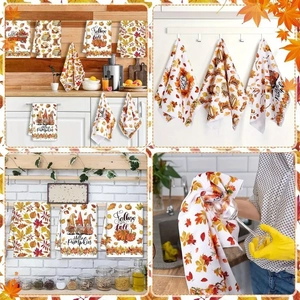 Detail view of microfiber dish towels with autumn pumpkin and maple leaf patterns