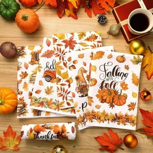 Set of four autumn kitchen towels with pumpkin and leaf prints on wood background