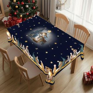 Detail of blue Nativity scene tablecloth with golden stars for Christmas dining decor