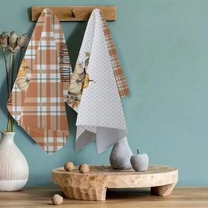 Detail of microfiber hanging kitchen towels with pumpkin prints and hello pumpkin text