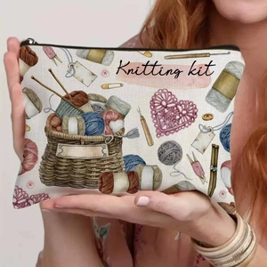Detail of vintage canvas knitting kit bag featuring hand-drawn needlework print and zipper