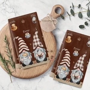 Braunes Küchentuch mit Kaffee-Gnom-Design und Text auf rundem Holztablett