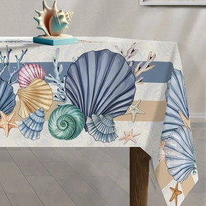 Detailed view of marine themed tablecloth with seashell starfish prints and blue stripes