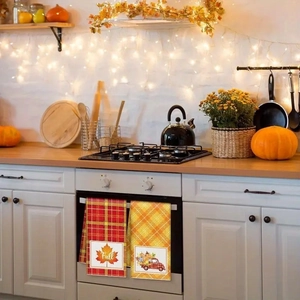 Detail of autumn microfiber dish towels with pumpkin and maple leaf harvest prints