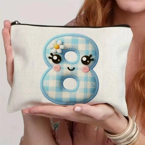 Close-up of cream canvas storage bag with a cute blue checkered number 8 and cartoon face