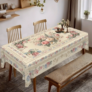 Detailed macro view of vintage floral tablecloth with delicate pink roses and blue blossoms