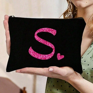 Schwarze Kosmetiktasche mit pinkfarbenem Glitzer-Buchstaben S und Herz-Aufdruck
