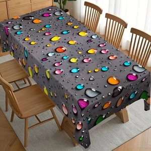 Detailed close-up of 3D colorful water drop pattern on a waterproof tablecloth