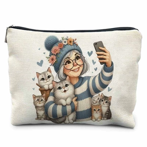 Close-up of canvas makeup bag featuring grandma and cats selfie illustration with zipper