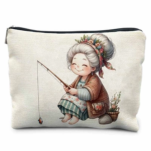Close-up of a canvas makeup bag featuring a cartoon granny fishing illustration with zipper