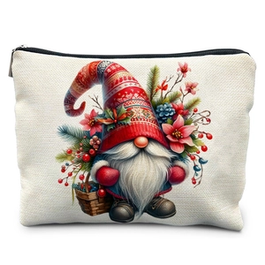 Close-up of winter watercolor Christmas gnome illustration on a cream linen cosmetic bag
