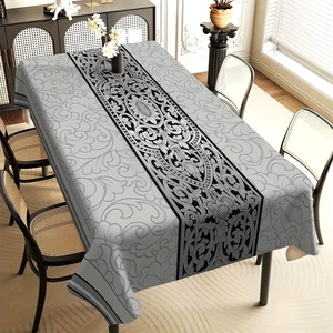 Detailed pattern of grey floral tablecloth with black central decorative strip for dining