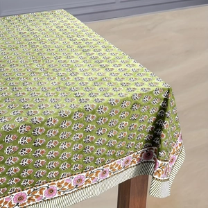 Close-up of floral geometric tablecloth with block print pattern and pink border