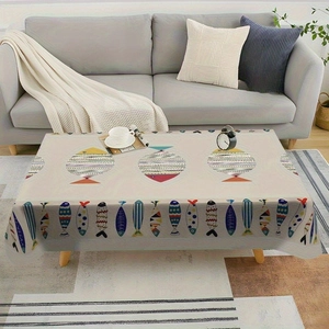 Detailed close-up of colorful fish patterns on the edge of the summer table cloth