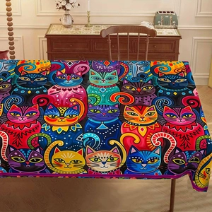 Detail of a rectangle tablecloth featuring colorful pop art cartoon cat patterns