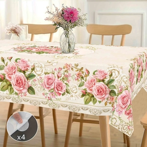 Detail of floral tablecloth featuring pink roses and 4 adhesive fasteners for secure fit