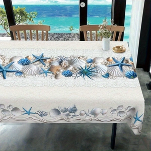 Detail of summer tablecloth featuring blue starfish, shells, and delicate lace edges