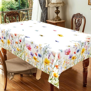 Floral geometric summer tablecloth with realistic wildflower patterns on a wooden table