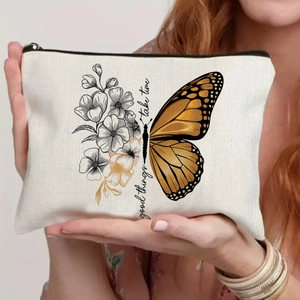 Detail of canvas makeup bag with butterfly and floral print plus good things take time quote