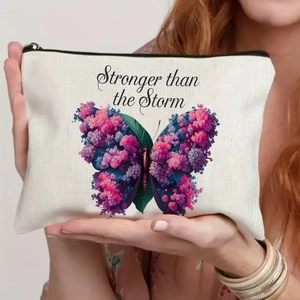Detail of canvas bag with butterfly print and Stronger than the Storm quote