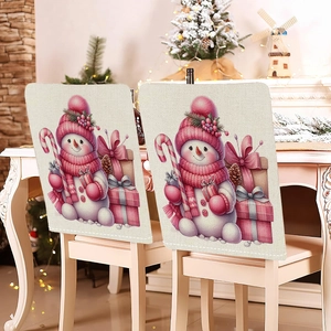 Close-up of pink snowman pattern on linen Christmas chair covers for dining room decor