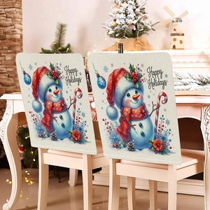 Detail of Christmas snowman chair covers with Happy Holidays text and festive decor
