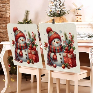 Detailed close-up of cute snowman chair covers on wooden chairs in cozy festive setting
