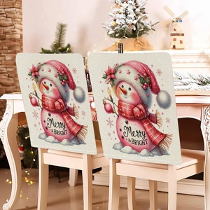 Detail of linen Christmas chair covers featuring cute snowman and Merry & Bright text