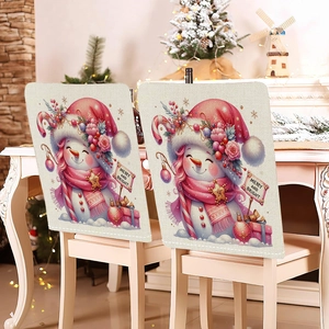 Detail of Christmas snowman chair covers with Merry and Bright print on white chairs