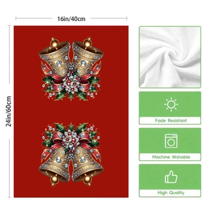 Detail of Christmas red towels featuring bells and holly motifs, 16x24 inch two-piece set