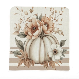 Detail of harvest pumpkin and floral watercolor print on rustic woven chair cover fabric
