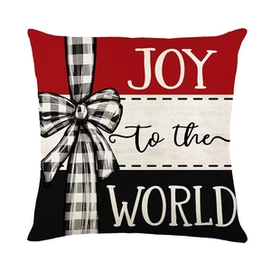 Kerst kussenhoes met Joy to the World tekst en rode geruite strik decoratie