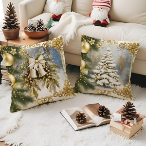 Golden Christmas pillow covers with festive tree and bell patterns on a white sofa set