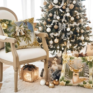 Golden Christmas bell and reindeer pillow covers on a white vintage chair with festive decor