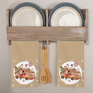 Christmas gingerbread truck kitchen towels in khaki cotton hanging in a cozy kitchen setup